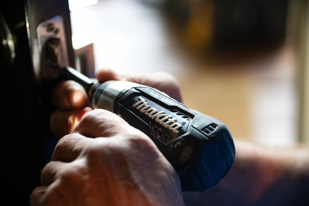 Hand holding a power drill